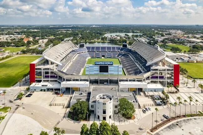 Aerial view of Camping World Stadium, formerly the Florida Citrus Bowl, in Orlando, Florida, showing the seating bowl, field and surrounding plaza