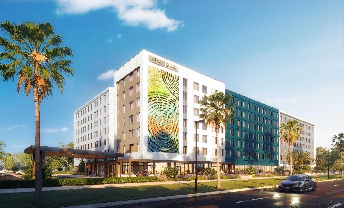 Rendering of the seven-story dual-branded EVEN Hotel and Staybridge Suites on Universal Blvd in Orlando, Florida, with a patterned facade panel and palm trees